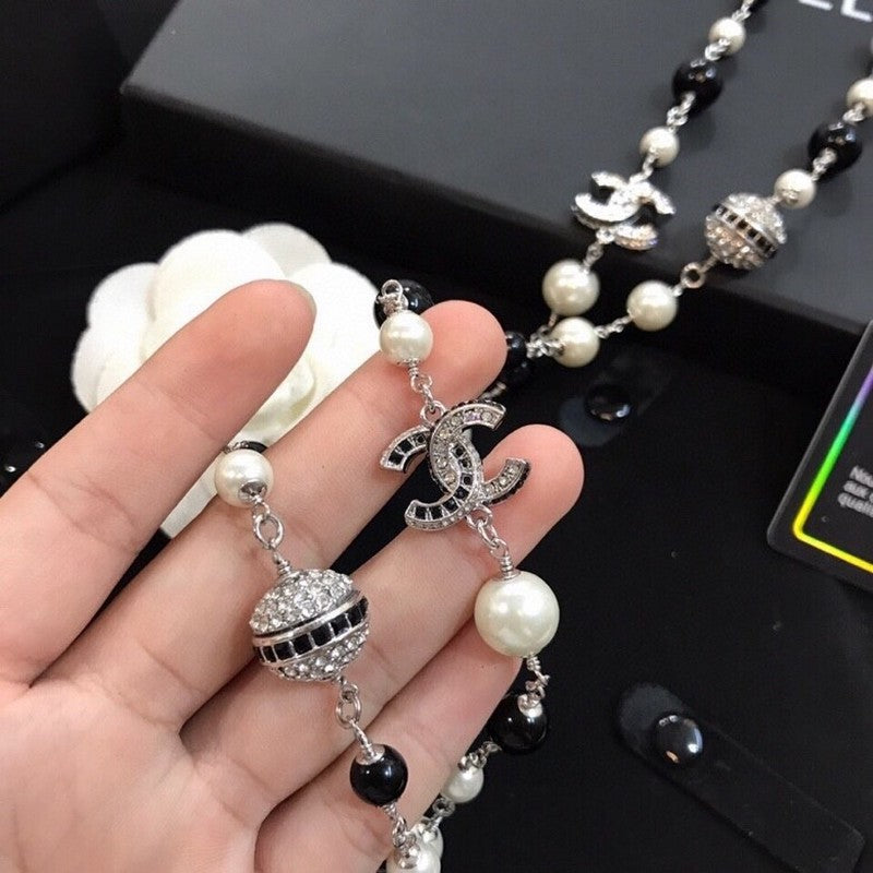 18K  Chanel Long Black Pearl Necklace