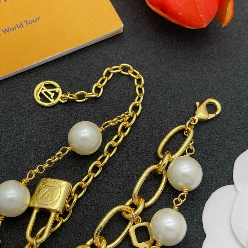 18K Louis Vuitton Pearl Lock Gold Bracelet